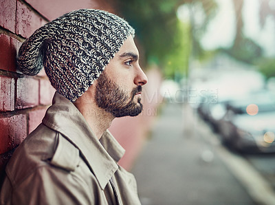 Buy stock photo Shot of a fashionable young man wearing urban wear in the city
