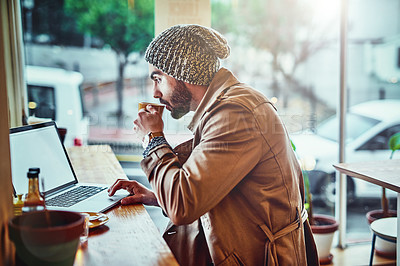 Buy stock photo Editor, laptop and man with coffee in cafe for online connection, typing article or information on blog. Lens flare, journalist and person with hot beverage for proof reading, remote work or report