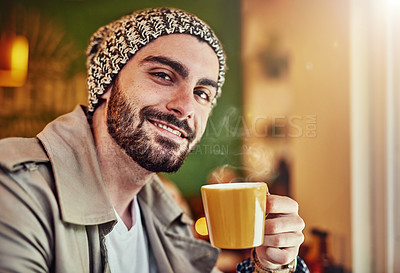 Buy stock photo Portrait of a stylish young man smiling while drinking a coffee in a cafe