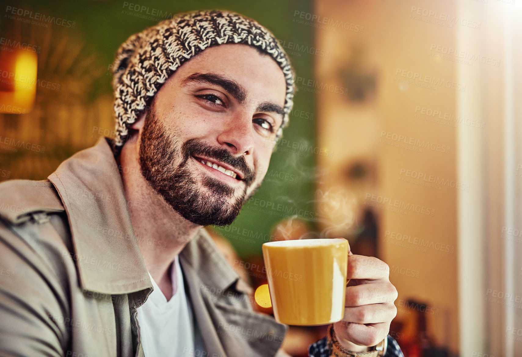 Buy stock photo Portrait of a stylish young man smiling while drinking a coffee in a cafe