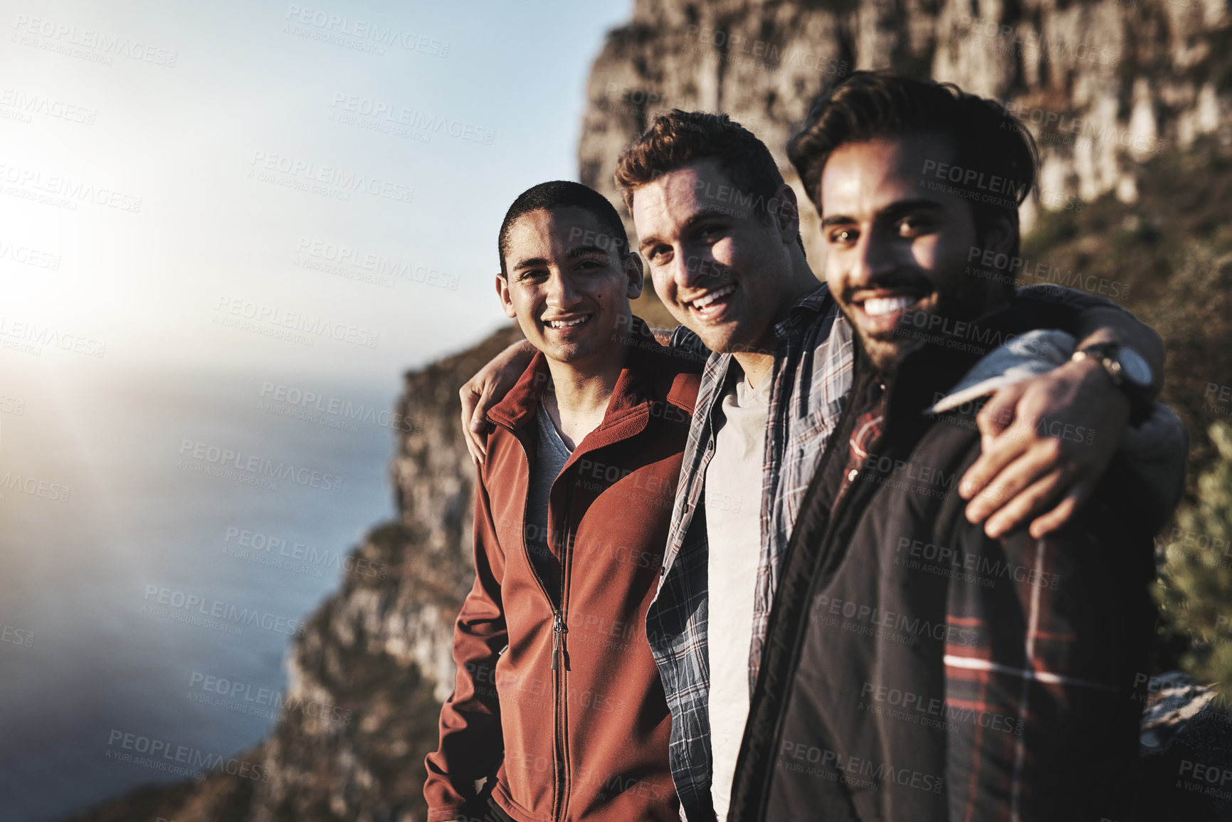 Buy stock photo Portrait of a group of friends admiring the view while hiking in the mountains