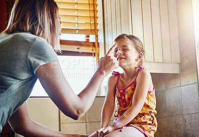 Buy stock photo Cropped shot of a mother and her little daughter having fun while doing housework at home