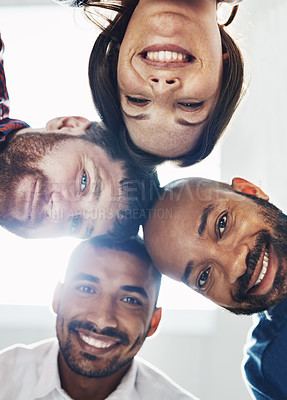 Buy stock photo Portrait of a group of young colleagues huddled together in solidarity