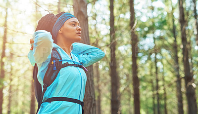 Buy stock photo Cropped shot of an athletic young woman out for a jog in the woods