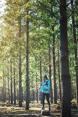 Buy stock photo Trail, running and girl in woods with fitness, trees and health challenge in morning workout. Nature, exercise and woman runner in forest for outdoor marathon, endurance training and wellness in park