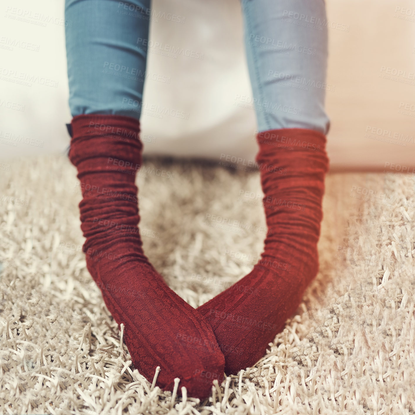 Buy stock photo Cropped shot of a young woman wearing warm sock