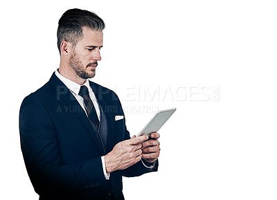 Buy stock photo Studio shot of a businessman using a digital tablet against a white background