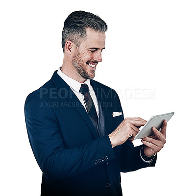 Buy stock photo Studio shot of a businessman using a digital tablet against a white background