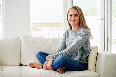 Buy stock photo Full length portrait of an attractive young woman sitting on the sofa at home