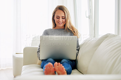 Buy stock photo Woman, laptop and relax on sofa with smile for streaming, subscription or movie in home living room. Person, computer and happy for search, film or reading post on social media at apartment in Berlin