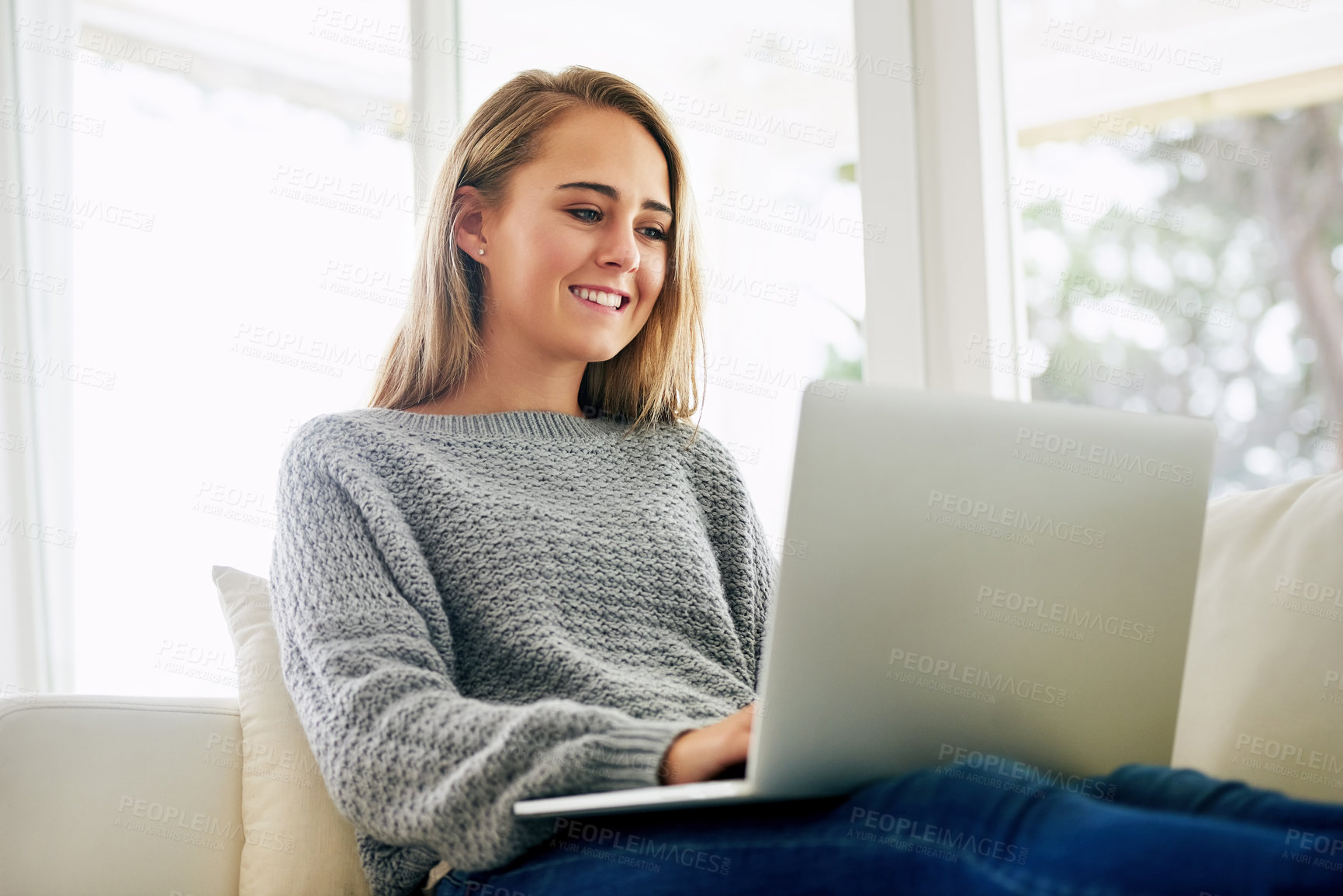 Buy stock photo Remote work, woman and happy with laptop for news, research and email at home. Female student, smile and computer in living room for job searching, internship opportunity and feedback in Australia