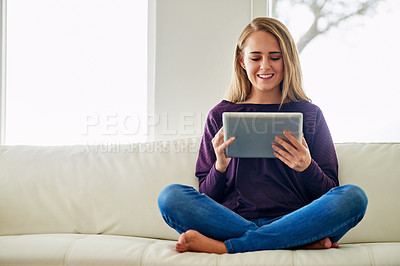 Buy stock photo Reading, online and woman with tablet, lounge and smile for romance ebook for break, chill and home. Living room, relax and girl on sofa, digital and entertainment of fiction with internet in app