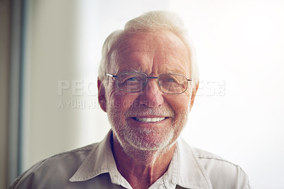 Buy stock photo Portrait, home and old man with glasses, smile and happiness with confidence, peace or retirement. Face, senior person or pensioner with eyewear, wrinkles or apartment with joy, elderly care or relax