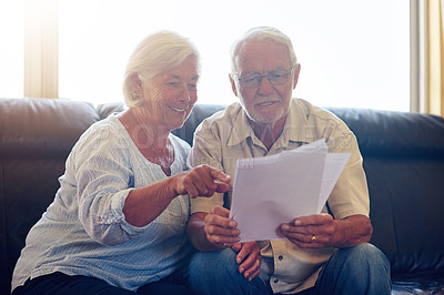 Buy stock photo Senior couple, happy and papers in home for budget, mortgage and bank letter together in summer. Man, woman and financial documents in house for planning retirement holiday, policy and life insurance