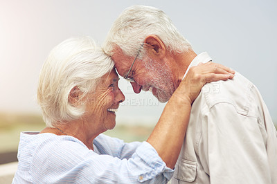 Buy stock photo Shot of a happy senior couple spending time together outdoors