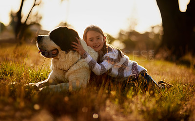 Buy stock photo Portrait of a cute little girl cuddling with her dog while they play outside