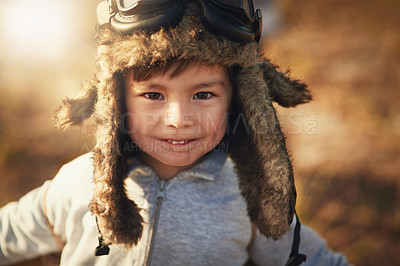 Buy stock photo Portrait of a cute little boy wearing a pilot's hat and goggles while playing outside