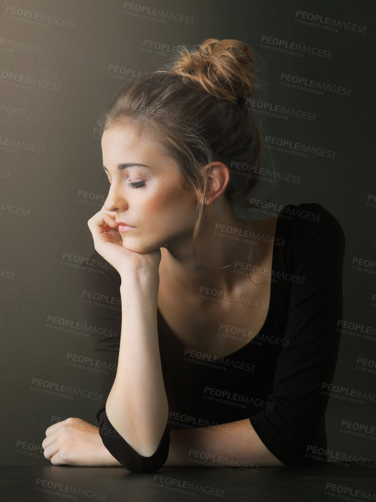 Buy stock photo Studio shot of a beautiful young woman posing against a brown background