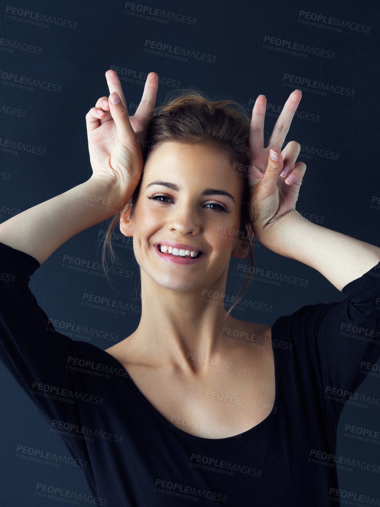 Buy stock photo Cropped shot of a beautiful young woman posing in the studio