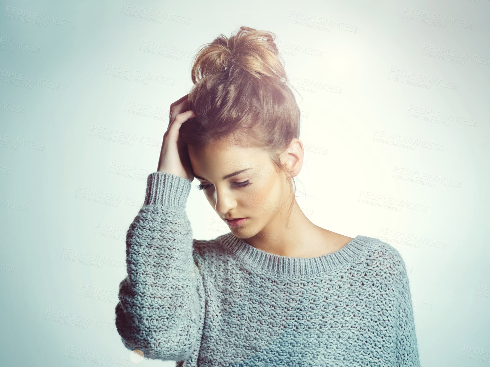 Buy stock photo Cropped shot of a beautiful young woman posing in the studio