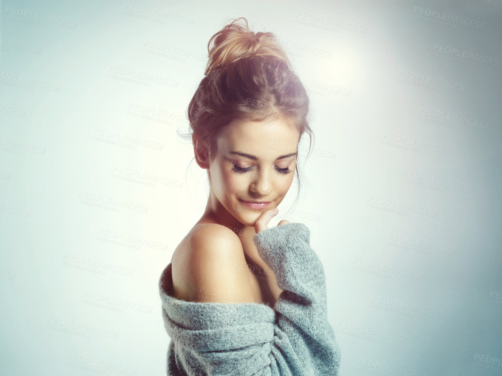 Buy stock photo Cropped shot of a beautiful young woman posing in the studio