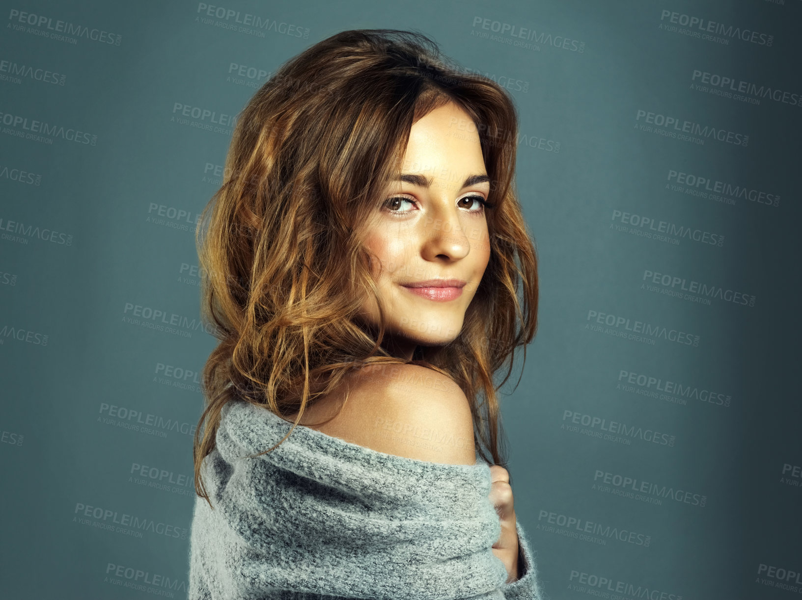 Buy stock photo Cropped shot of a beautiful young woman posing in the studio