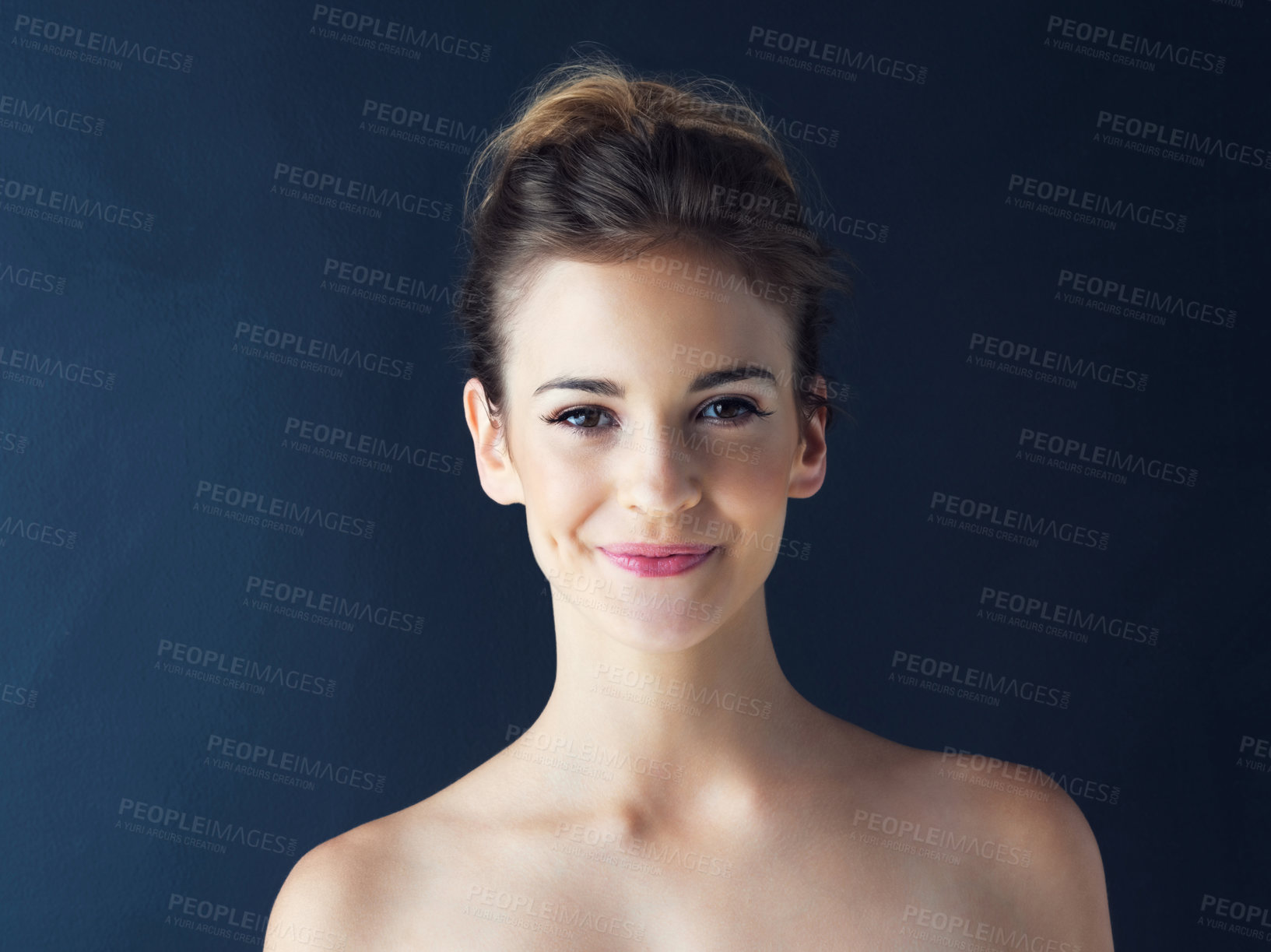 Buy stock photo Cropped shot of a beautiful young woman posing in the studio