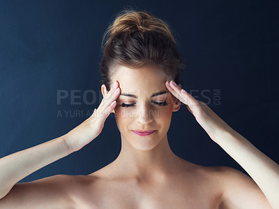 Buy stock photo Shot of a beautiful young woman holding her hands on her head