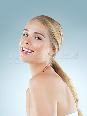 Buy stock photo Happy woman, portrait and makeup cosmetics in studio, transformation and beauty on blue background. Female person, skincare and foundation for smooth skin, facial treatment and dermatology pride