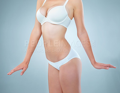 Buy stock photo Health, underwear and wellness with woman in studio on gray background for exercise or fitness. Abdomen, body and skin with figure of perfect model in bra and panties for diet or losing weight