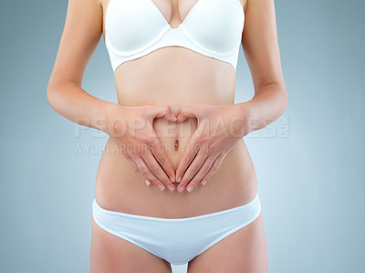 Buy stock photo Girl, hands and stomach for diet in studio on white background with underwear. Female person, isolated and belly or waist with tummy tuck for self care with gut health, weight loss and wellness