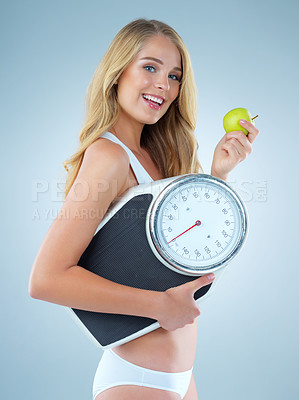 Buy stock photo Happy woman in portrait, apple and scale, lose weight and healthy food isolated on studio background. Female model with smile, health and diet with organic fruit with happiness and weightloss