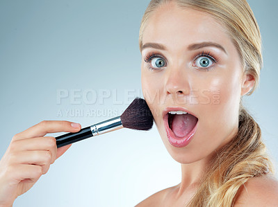 Buy stock photo Surprise, portrait and woman with makeup brush in studio for cosmetic, beauty and foundation of aesthetic. Female person, wow and salon tools for glamour, transformation and glow on blue background