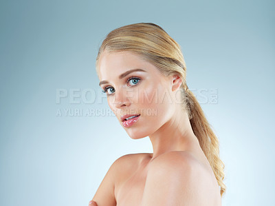 Buy stock photo Woman, portrait and makeup glow in studio, transformation and beauty on blue background. Female person, skincare and foundation for smooth skin, facial treatment and dermatology pride for shine