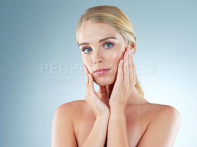 Buy stock photo Woman, portrait and cosmetics shine in studio, transformation and beauty on blue background. Female person, skincare feeling and foundation for smooth skin, facial treatment and dermatology pride