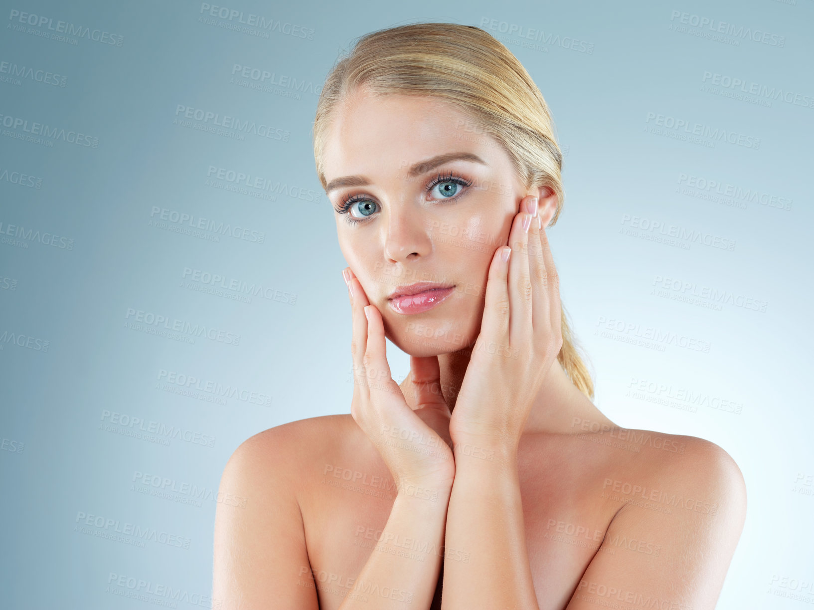 Buy stock photo Woman, portrait and cosmetics shine in studio, transformation and beauty on blue background. Female person, skincare feeling and foundation for smooth skin, facial treatment and dermatology pride