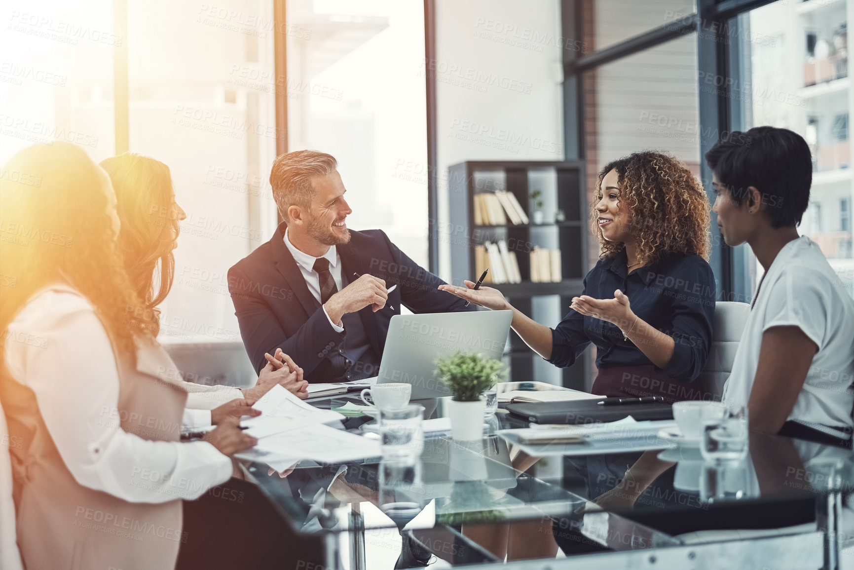 Buy stock photo Shot of a group of colleagues having a meeting in a modern office