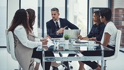 Buy stock photo Shot of a group of colleagues having a meeting in a modern office