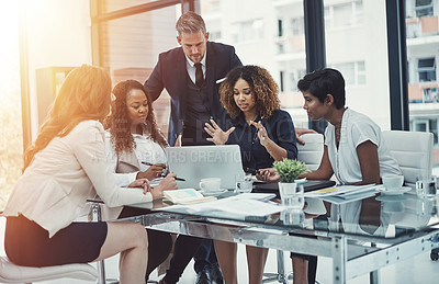 Buy stock photo Shot of a group of colleagues having a meeting in a modern office