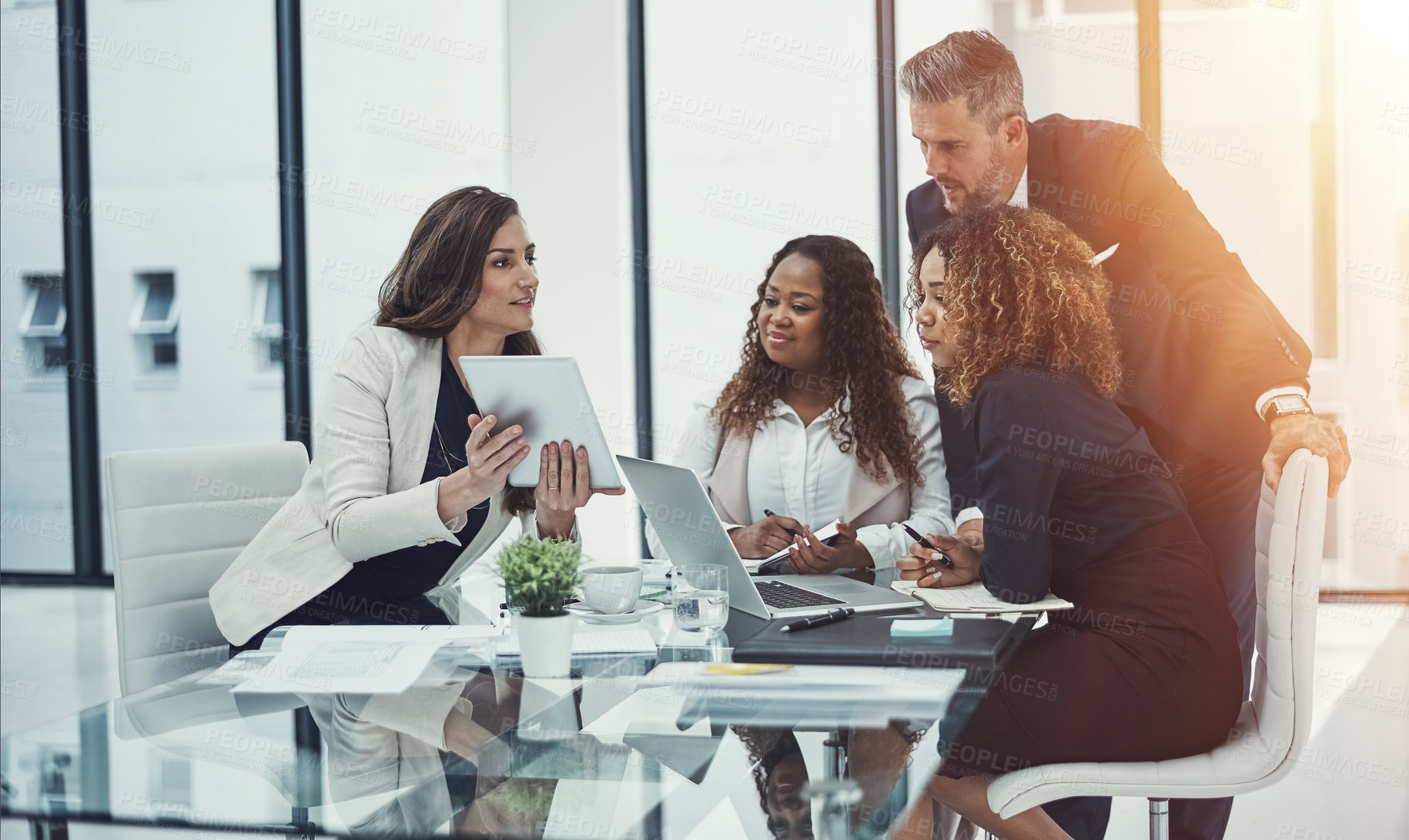 Buy stock photo Shot of a group of colleagues having a meeting in a modern office