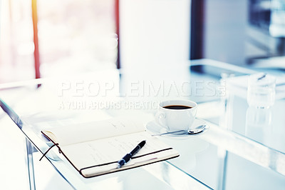 Buy stock photo Shot of a diary lying on a table in an empty office
