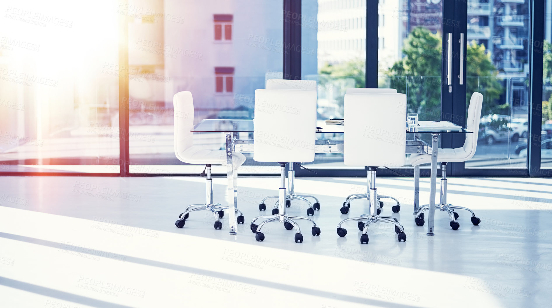 Buy stock photo Shot of an empty boardroom furnished with a table and chairs