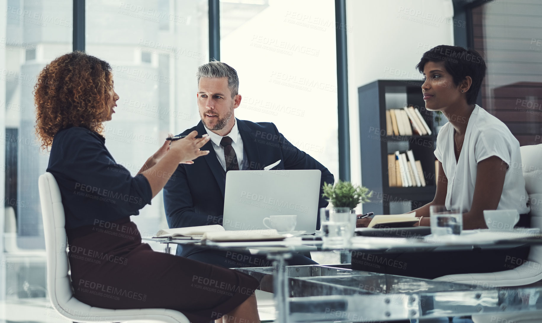 Buy stock photo Shot of a group of businesspeople having a meeting in the boardroom