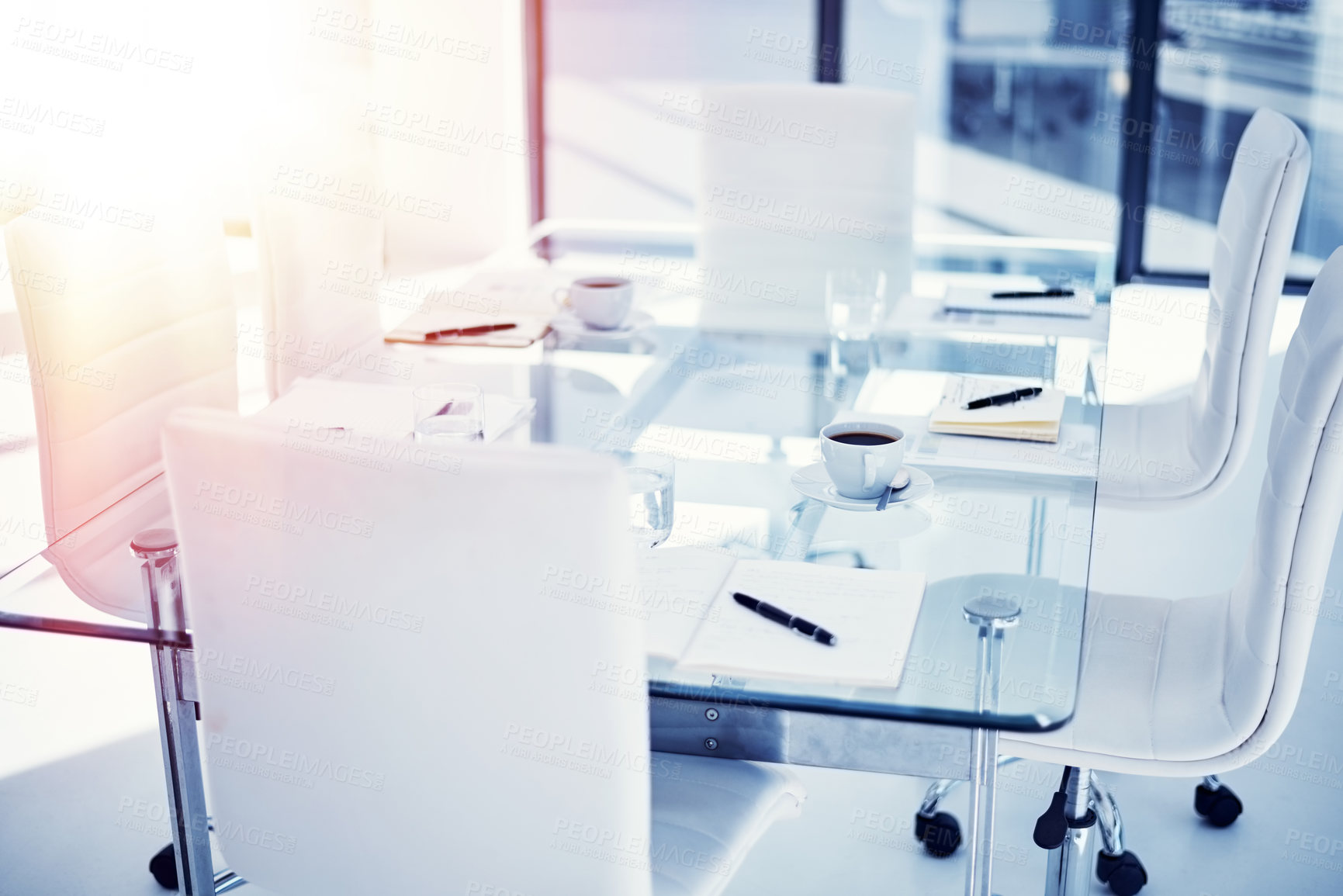 Buy stock photo Shot of an empty boardroom furnished with a table and chairs