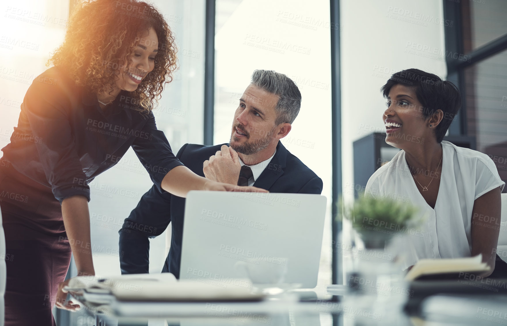 Buy stock photo Shot of a group of businesspeople having a meeting in the boardroom