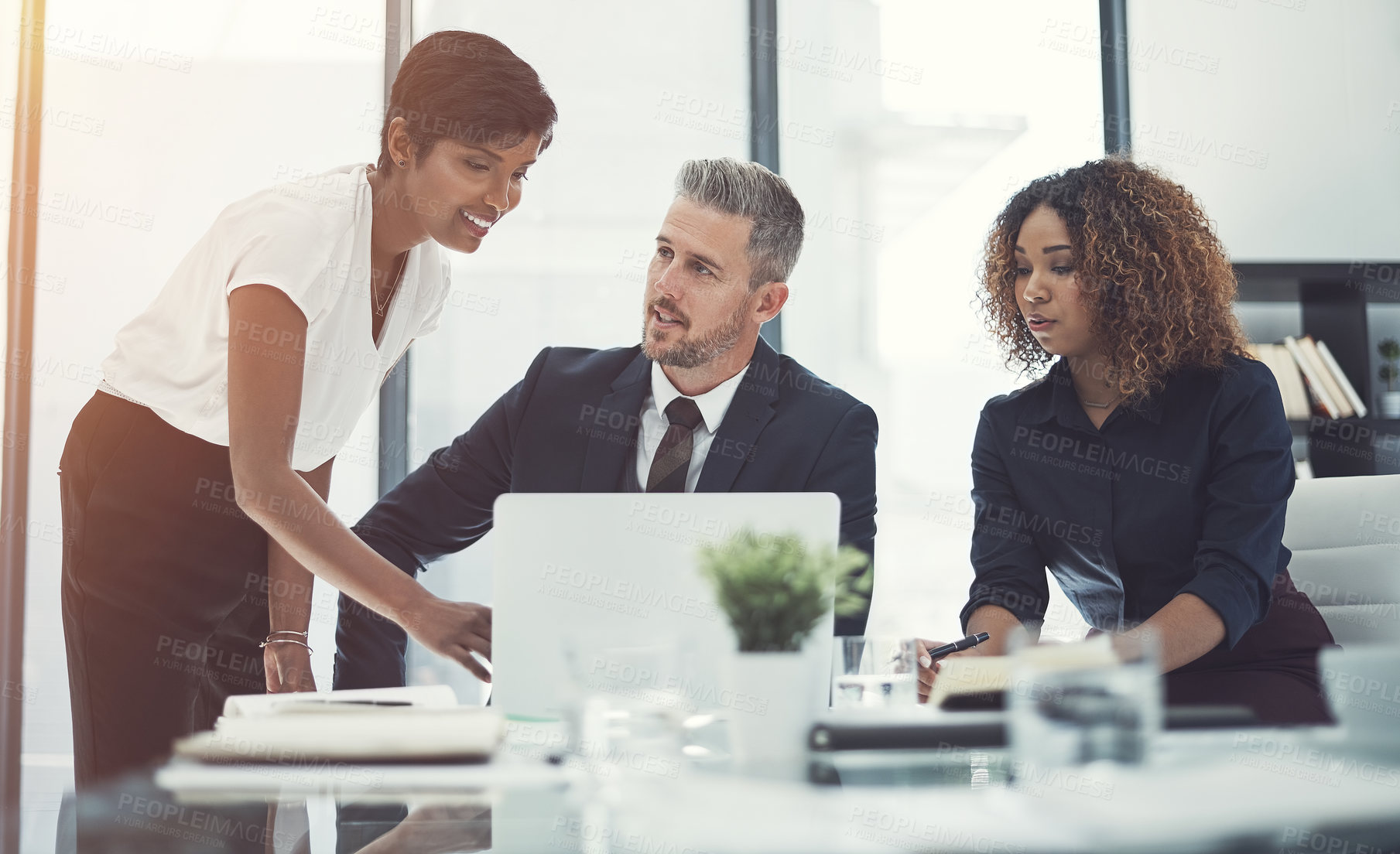 Buy stock photo Shot of a group of businesspeople having a meeting in the boardroom