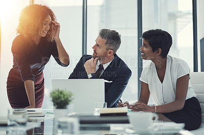 Buy stock photo Shot of a group of businesspeople having a meeting in the boardroom