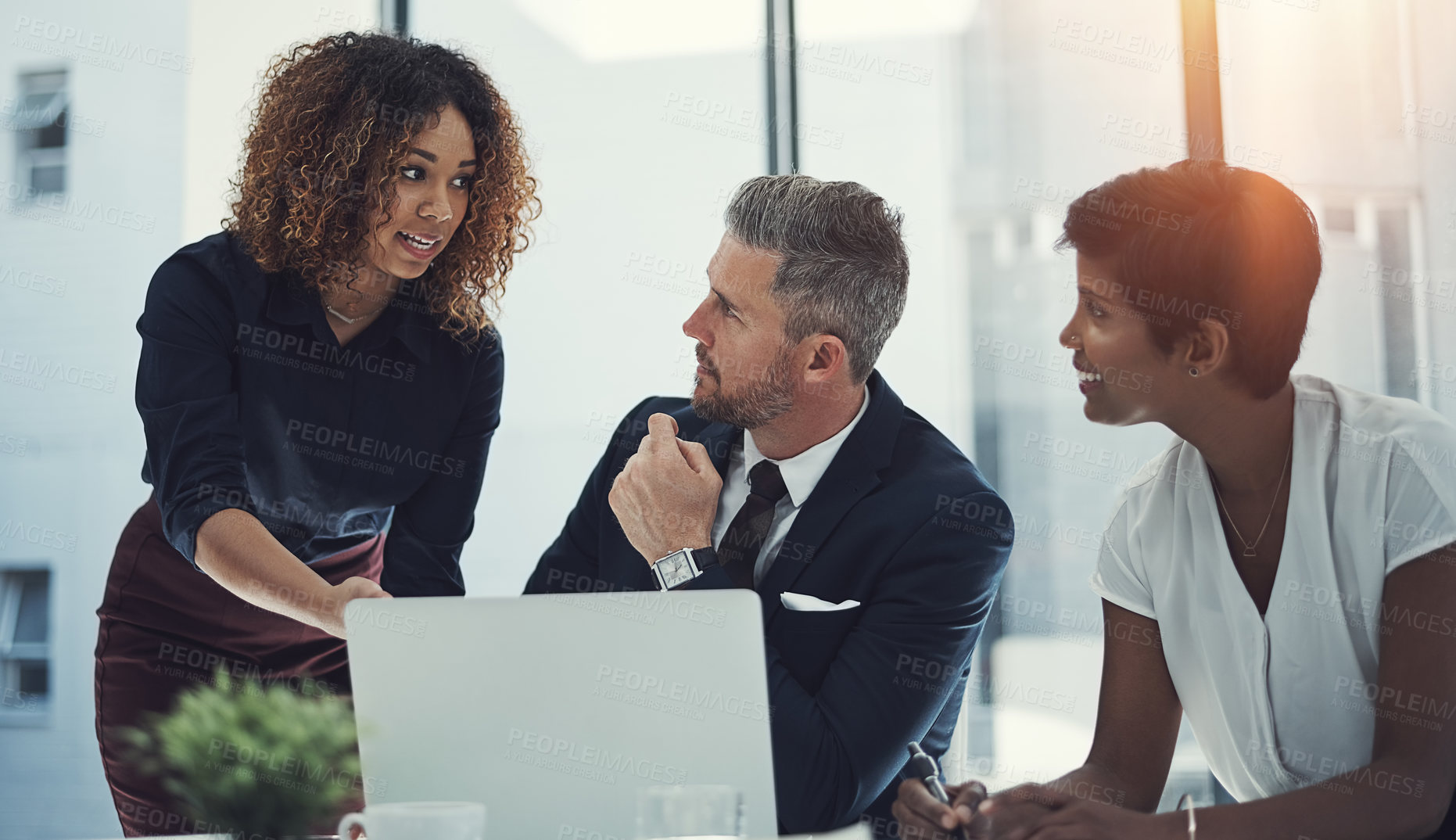 Buy stock photo Shot of a group of businesspeople having a meeting in the boardroom