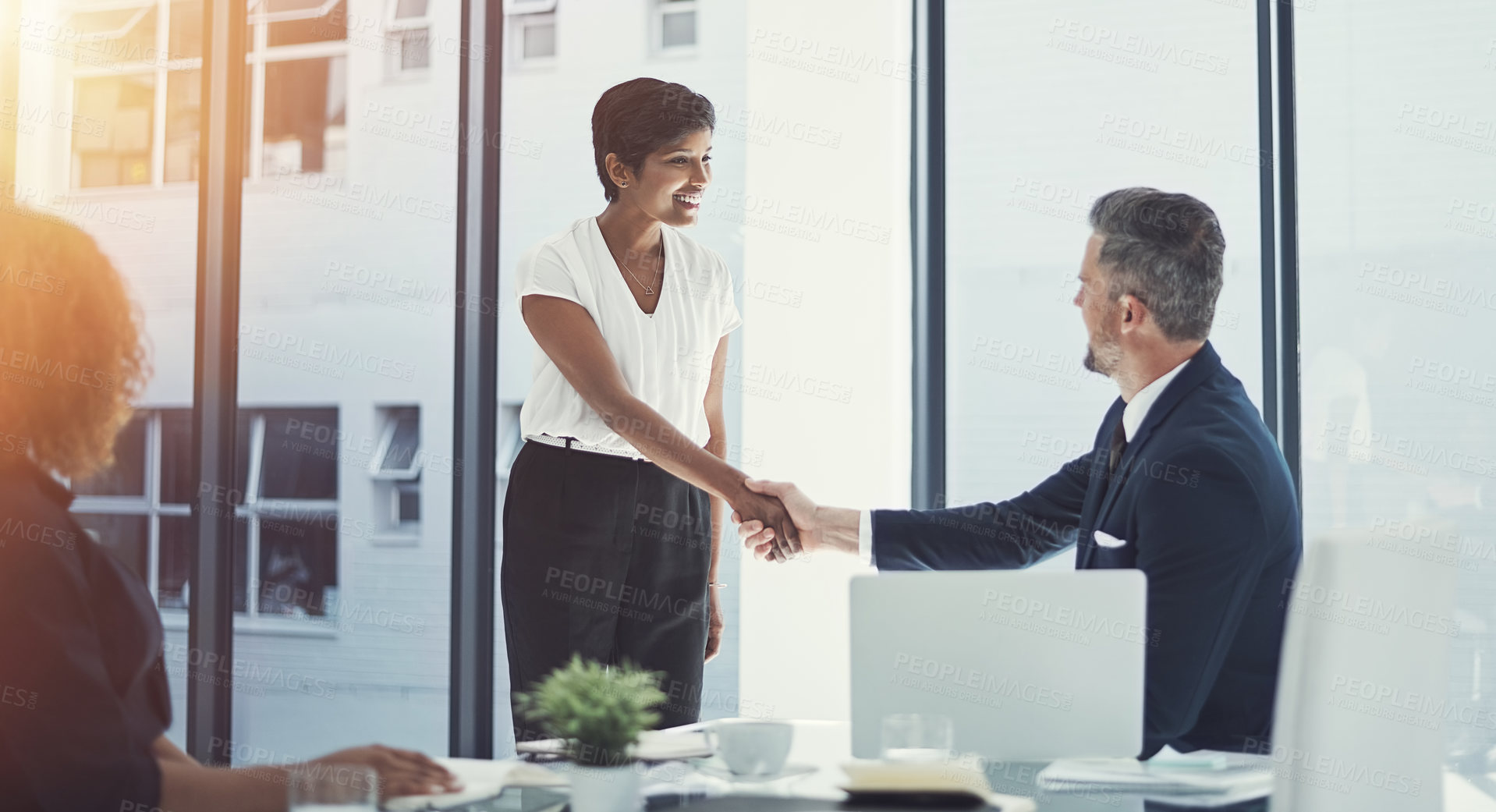 Buy stock photo Shot of a group of businesspeople having a meeting in the boardroom