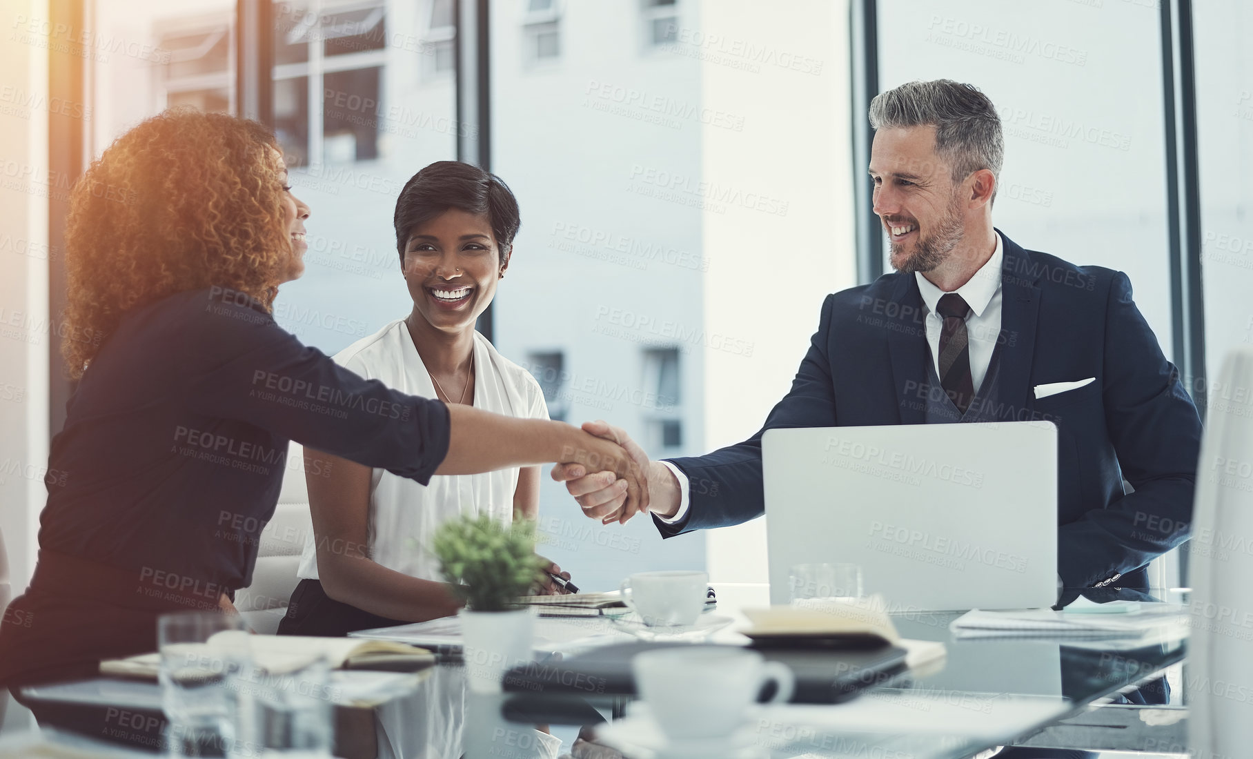 Buy stock photo Shot of a group of businesspeople having a meeting in the boardroom